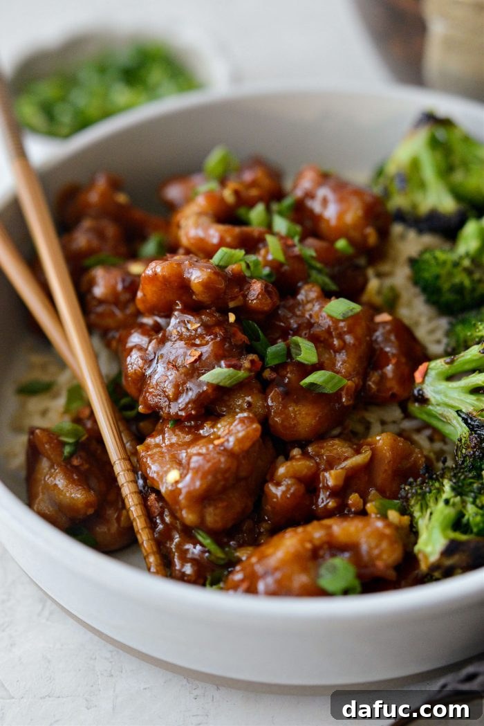 Unpacking 2022 12 General Tso's Chicken served with green onions over rice
