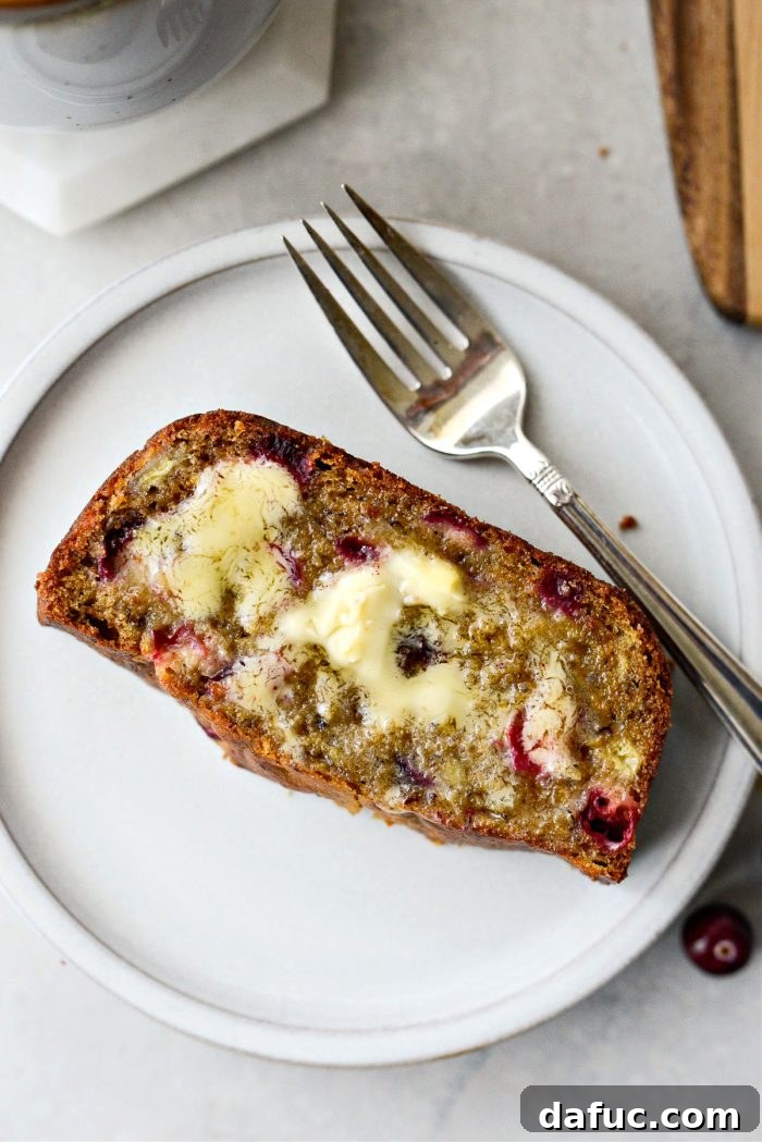 Unpacking 2022 13 Cranberry Orange Banana Bread slice with butter