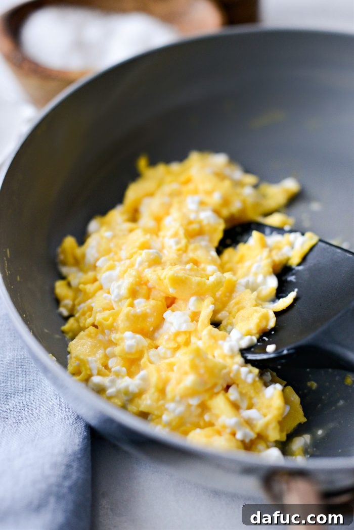 Creamy Cottage Scrambled Eggs 11 Mixing cottage cheese into the scrambled eggs
