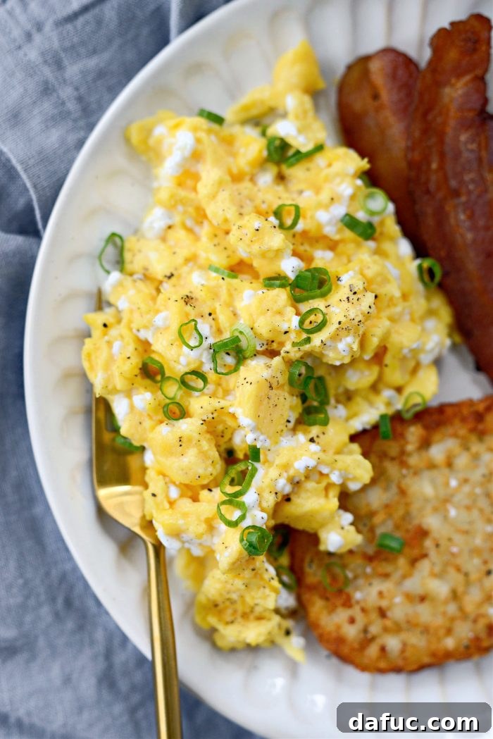 Creamy Cottage Scrambled Eggs 14 Scrambled Eggs with Cottage Cheese served on a plate with fresh pepper