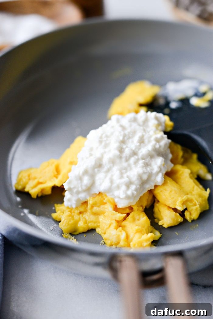 Creamy Cottage Scrambled Eggs 10 Seasoning scrambled eggs with salt and adding cottage cheese