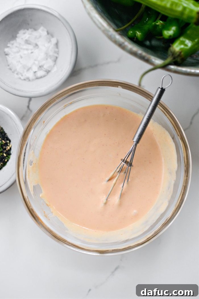 Finished spicy garlic sriracha aioli in a serving bowl