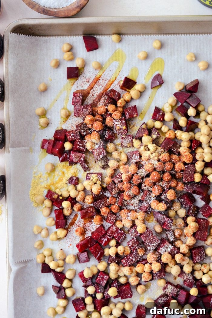 diced beets, chickpeas, oil and spices on sheet pan