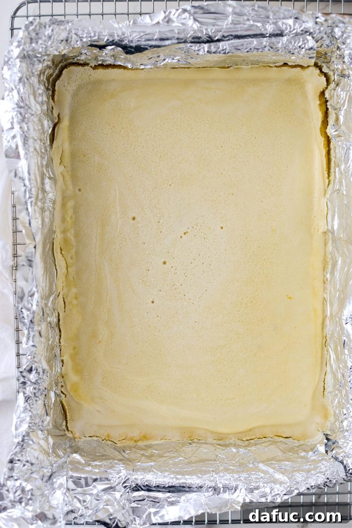 Freshly baked Meyer Lemon Bars cooling in the pan