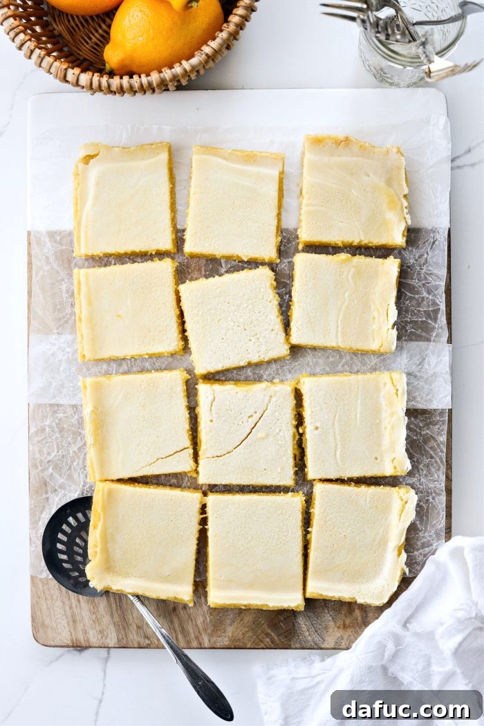 Meyer Lemon Bars being cut into squares after cooling