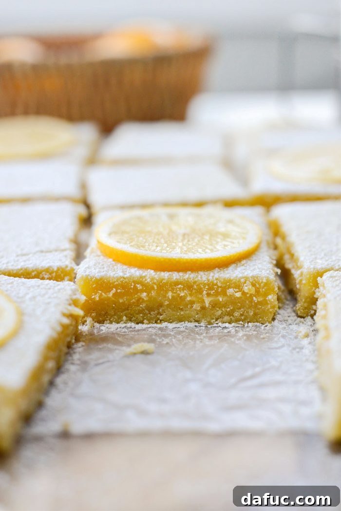 Close-up of a Meyer Lemon Bar with a fork taking a bite