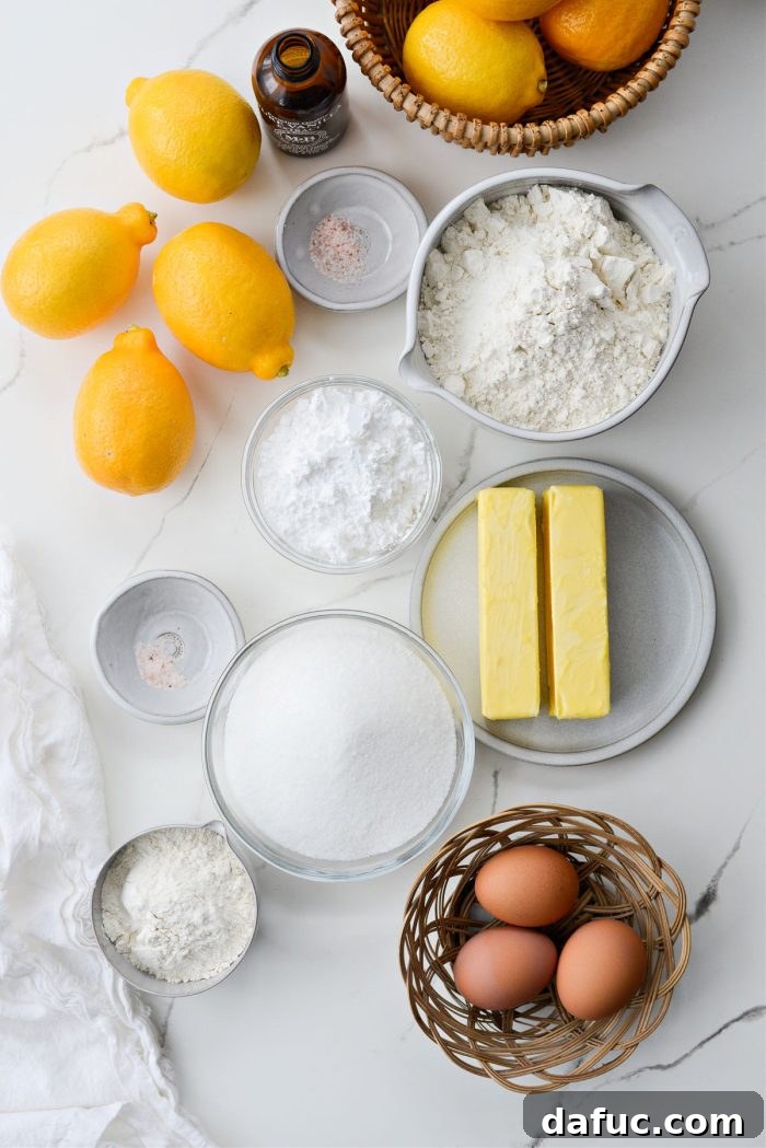 Arrangement of ingredients for Meyer Lemon Bars, including fresh Meyer lemons, butter, flour, and sugar