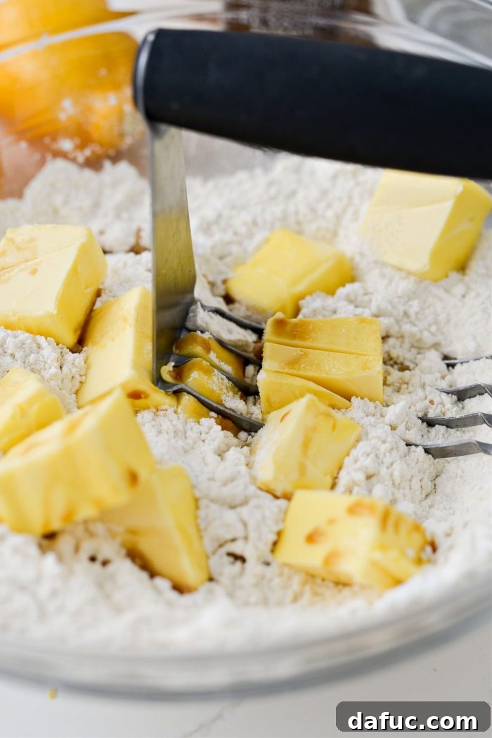 Mixing shortbread dough with a pastry blender