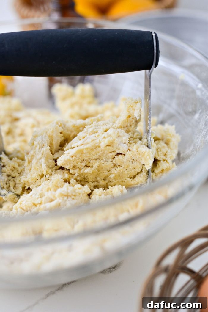 Shortbread dough mixture in a mixing bowl, ready for the pan