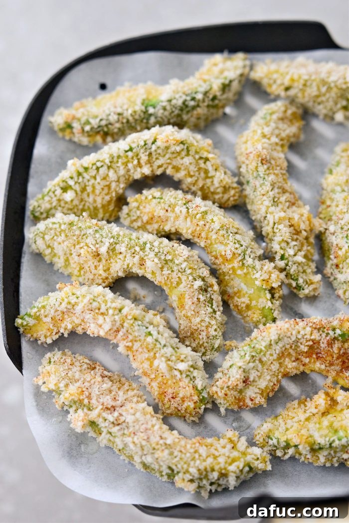 Breaded avocado fries before air frying