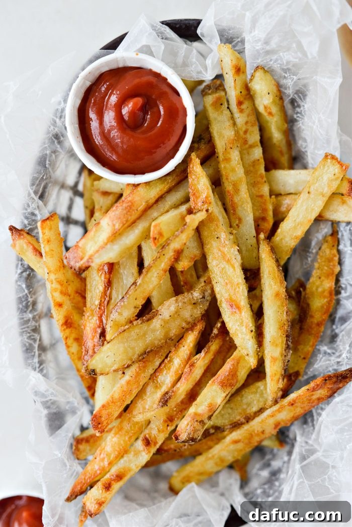 Golden Crispy Oven Fries 2 Perfectly crispy golden oven baked French fries served in a bowl, ready to eat.