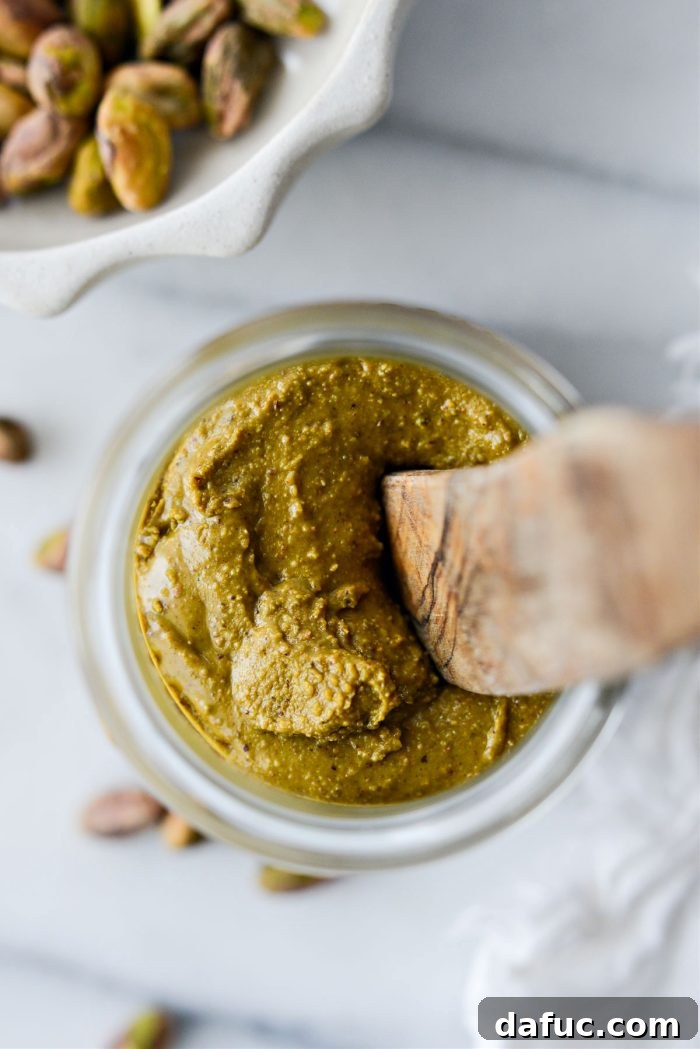 A beautiful close-up of creamy homemade pistachio butter, ready to be enjoyed.