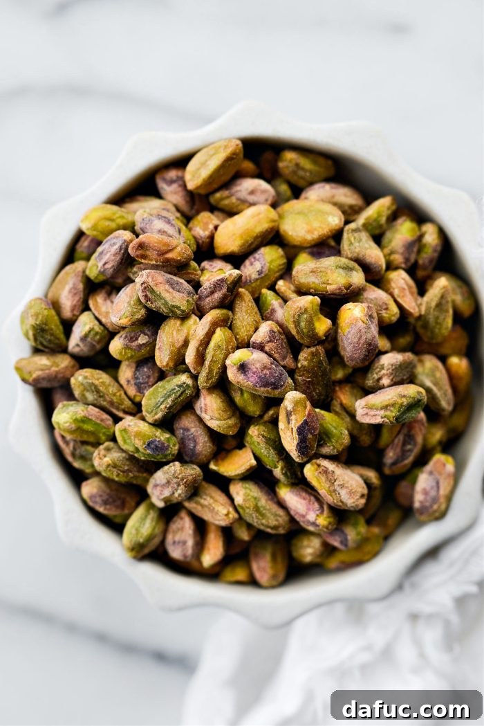 A bowl of shelled pistachios, the main ingredient for homemade pistachio butter.