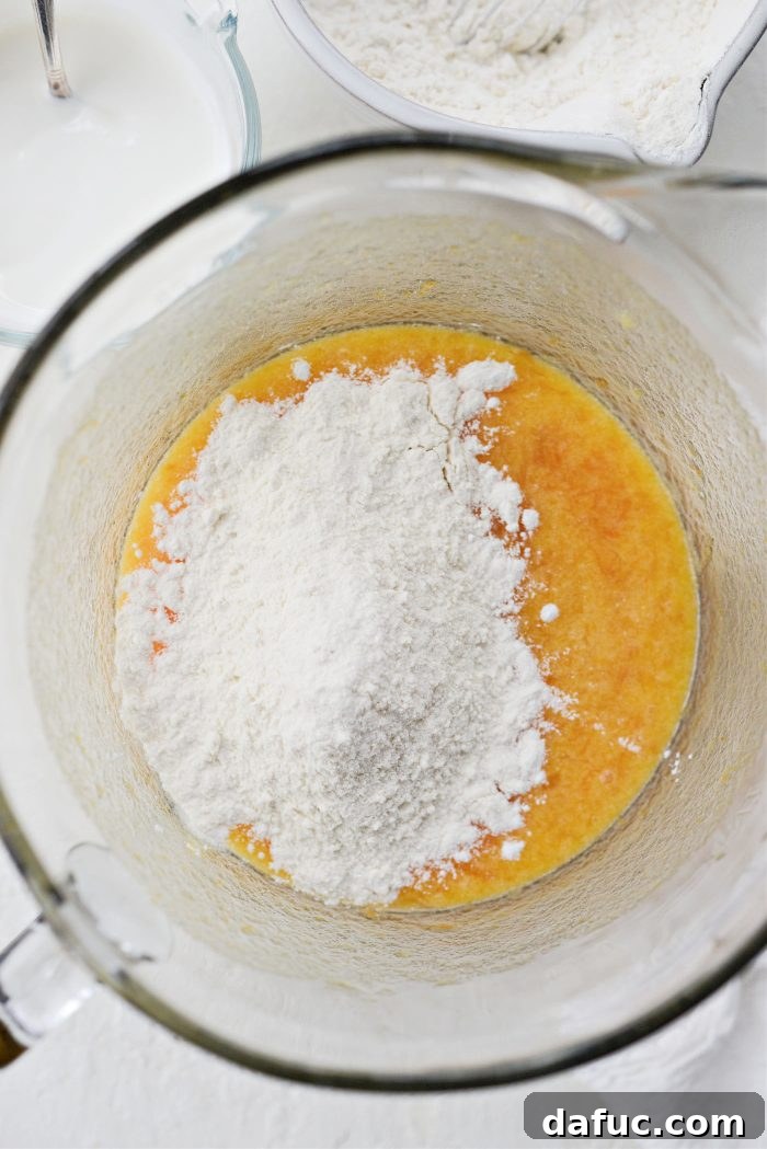 Creamy Grapefruit Zing Cake 11 Alternating additions of dry ingredients and sour cream mixture to the cake batter in stages
