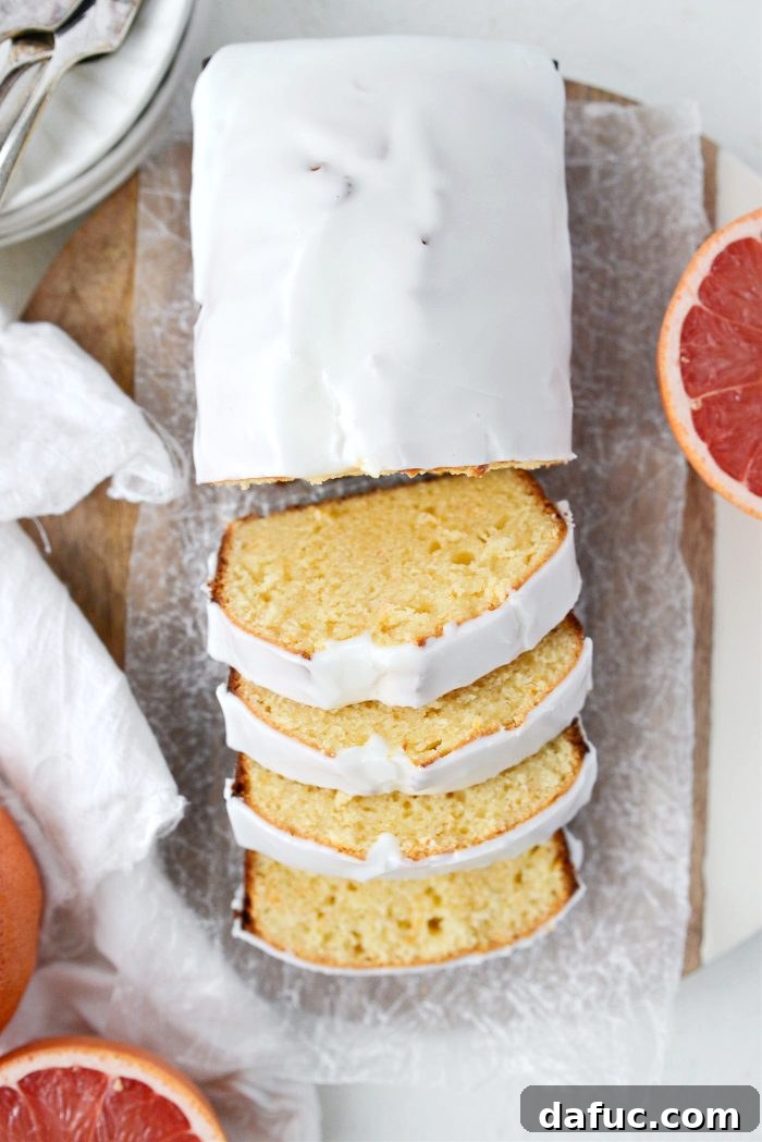 Creamy Grapefruit Zing Cake 17 A freshly sliced piece of Grapefruit Sour Cream Cake, ready to be served