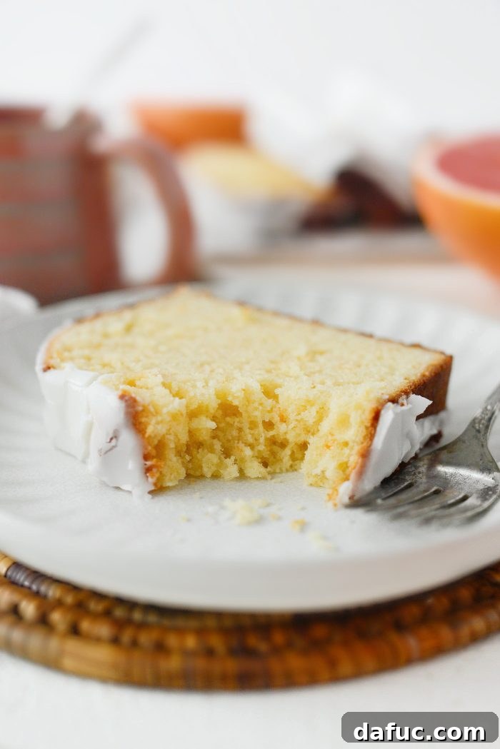 Creamy Grapefruit Zing Cake 20 The Grapefruit Sour Cream Cake sliced and beautifully presented, ready for serving