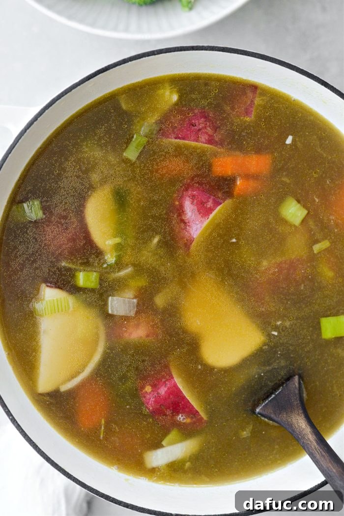Hearty Irish Vegetable Soup 11 Soup mixture in a Dutch oven coming to a boil.