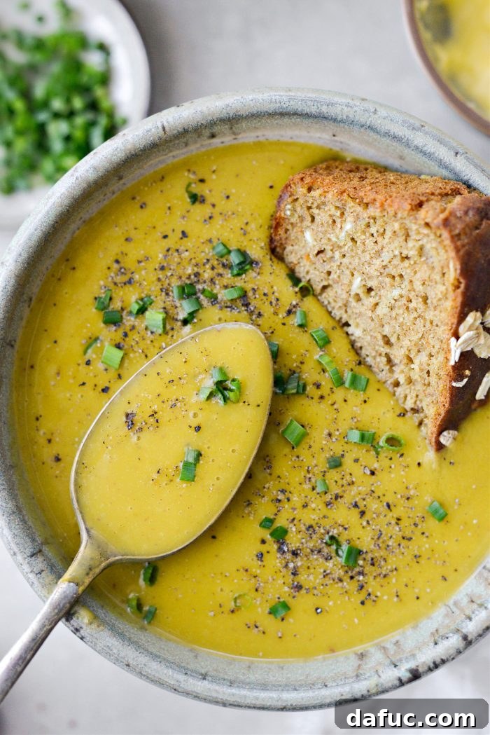 Hearty Irish Vegetable Soup 20 A spoon scooping a portion of creamy Irish Vegetable Soup.