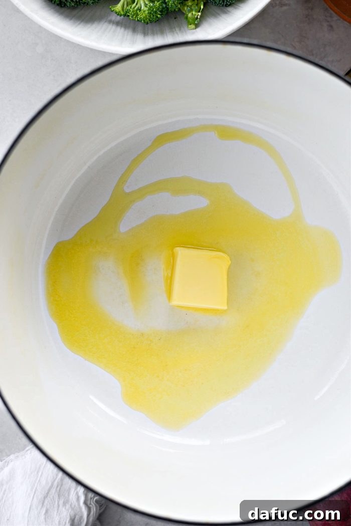 Hearty Irish Vegetable Soup 5 Melted butter and olive oil shimmering in a heavy Dutch oven, ready for vegetables.