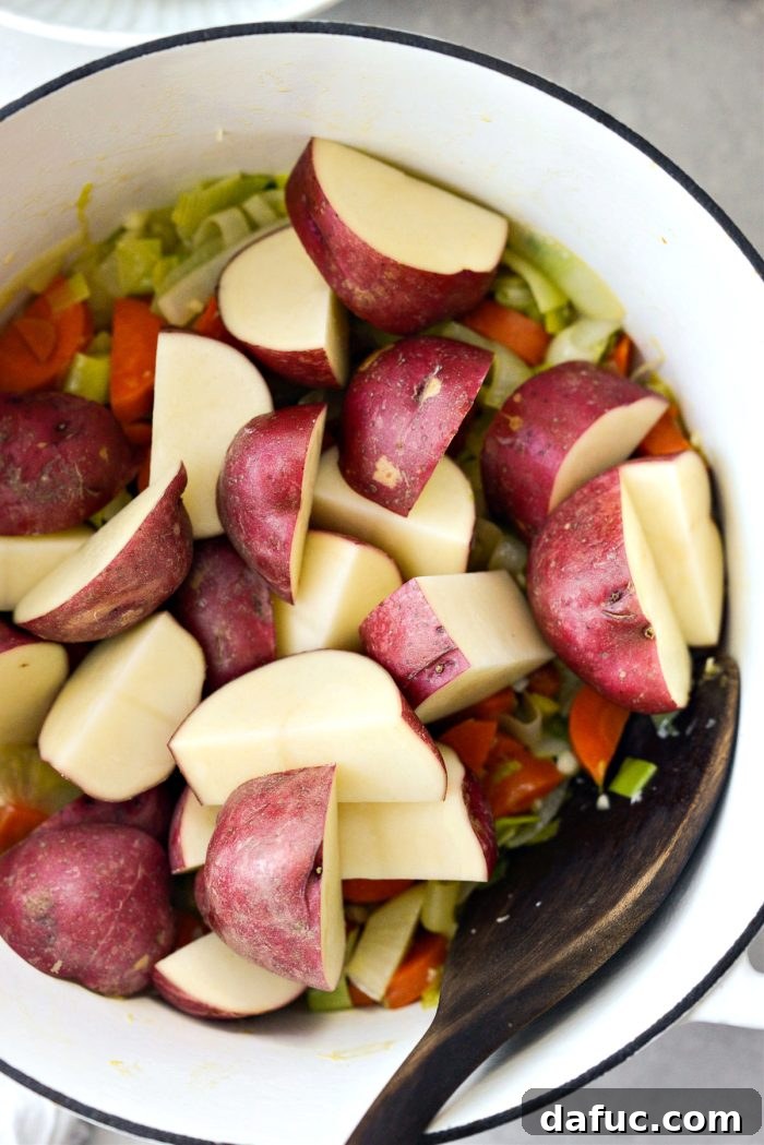 Hearty Irish Vegetable Soup 9 Chopped red skin potatoes added to the pot with other vegetables.