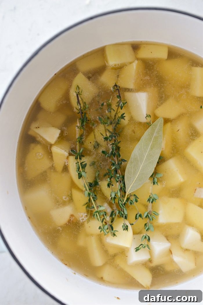 Hearty Cauliflower Potato Bisque 12 add broth, thyme and bay leaf