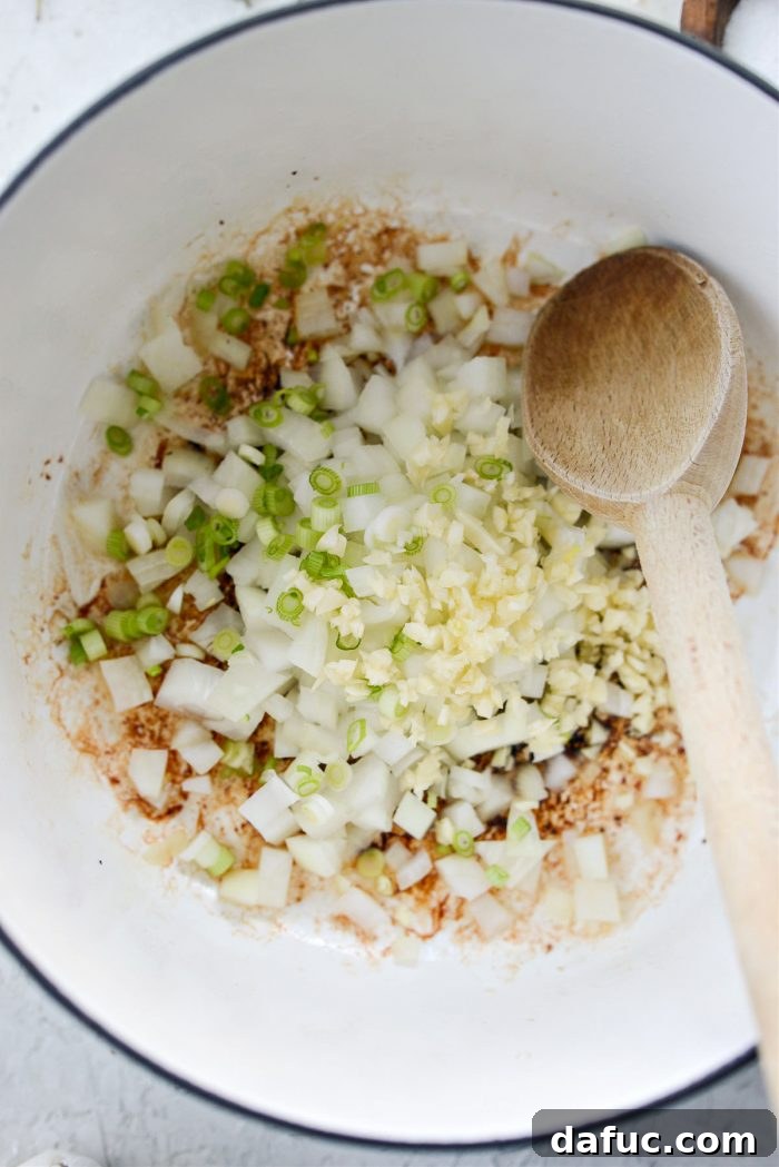 Hearty Cauliflower Potato Bisque 10 saute yellow onion, green onion and garlic in bacon fat