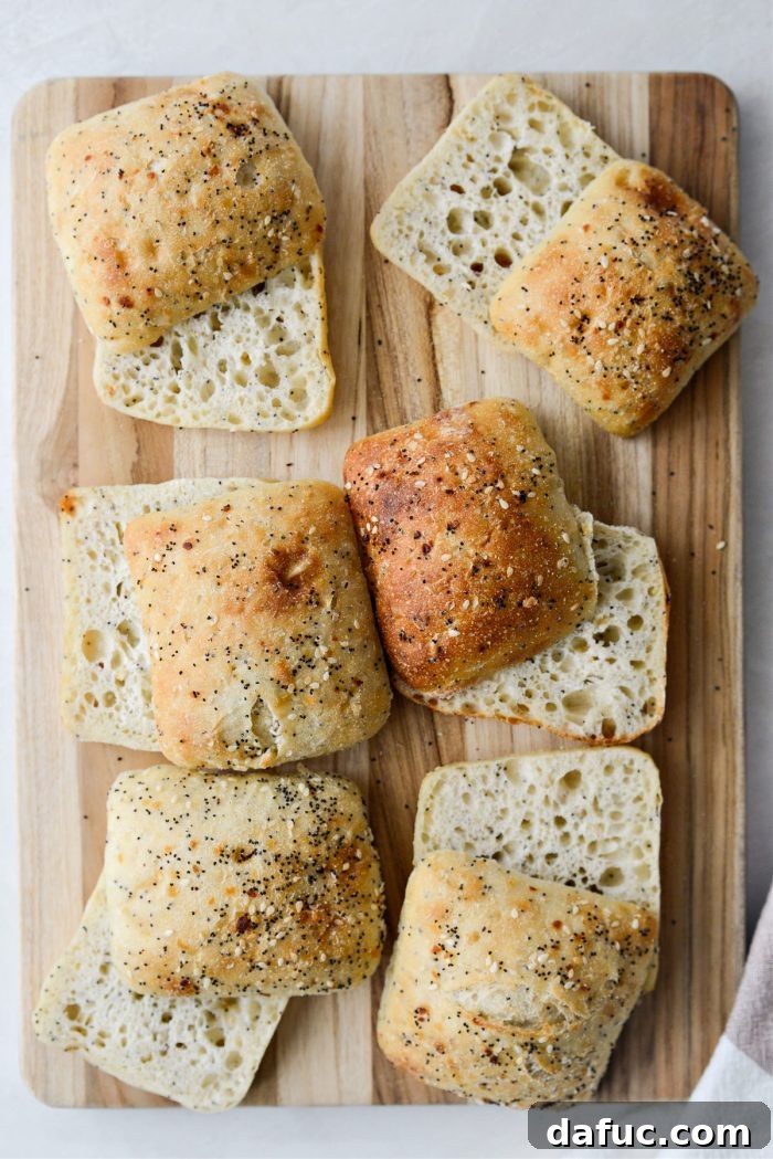 Everything rolls being cut horizontally for sandwich assembly