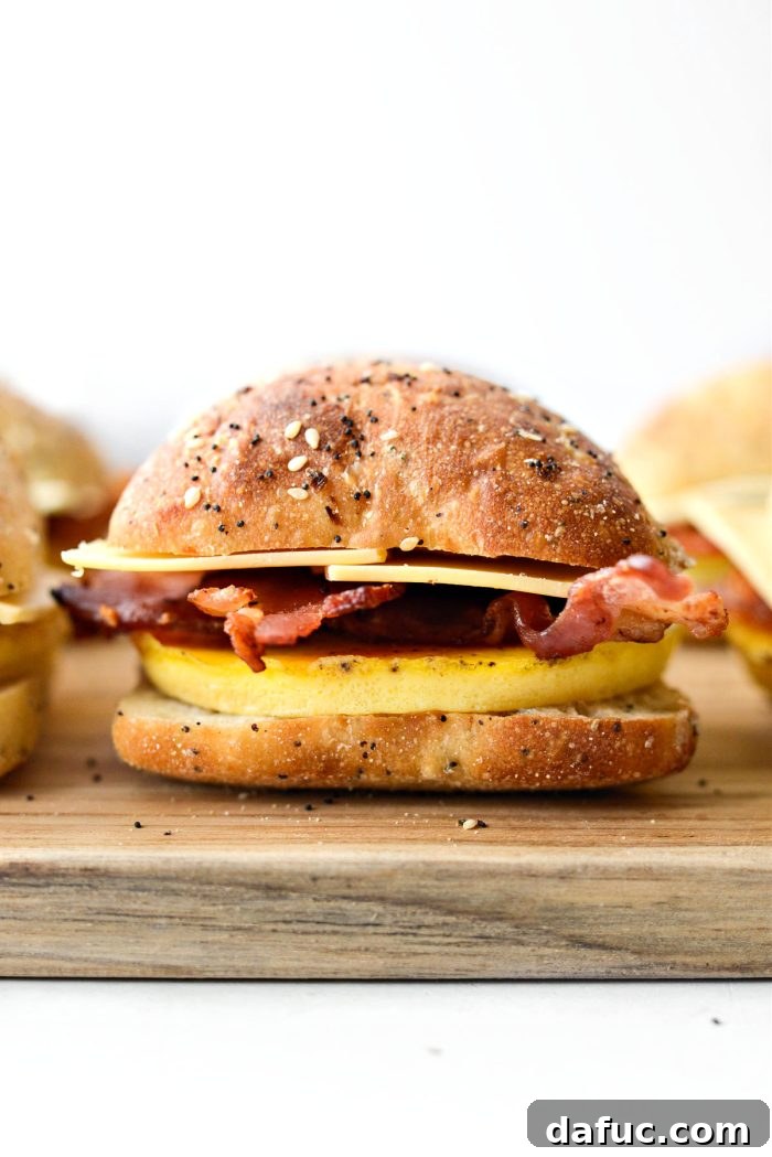 Assembled breakfast sandwiches with the top rolls replaced