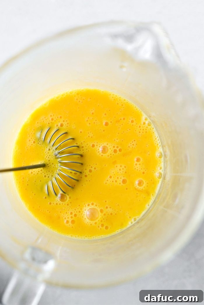 Whisked eggs in a bowl, thoroughly combined
