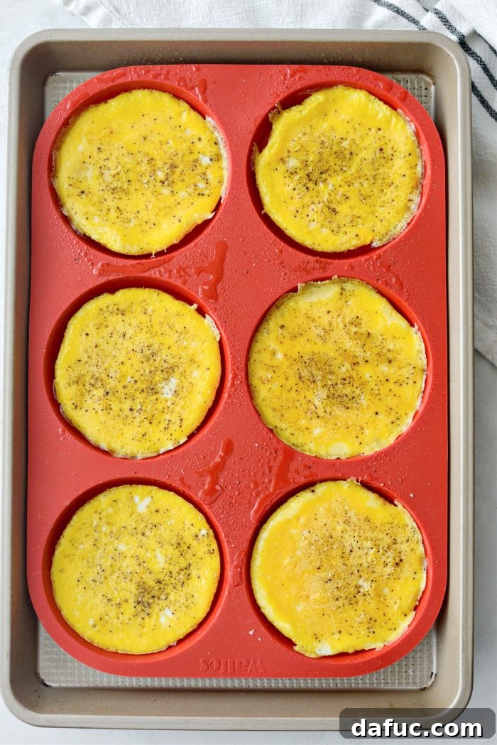 Baked egg rounds in a silicone mold, perfectly set