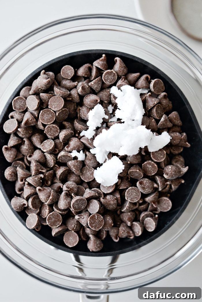 chocolate chips and coconut oil in double boiler