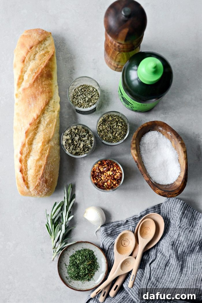 Garlic Herb Infused Dipping Oil 4 Ingredients laid out for homemade Garlic Herb Olive Oil Bread Dip