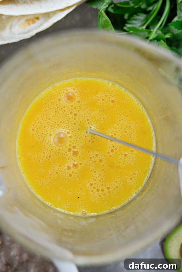 Well-whisked and fluffy eggs ready for scrambling