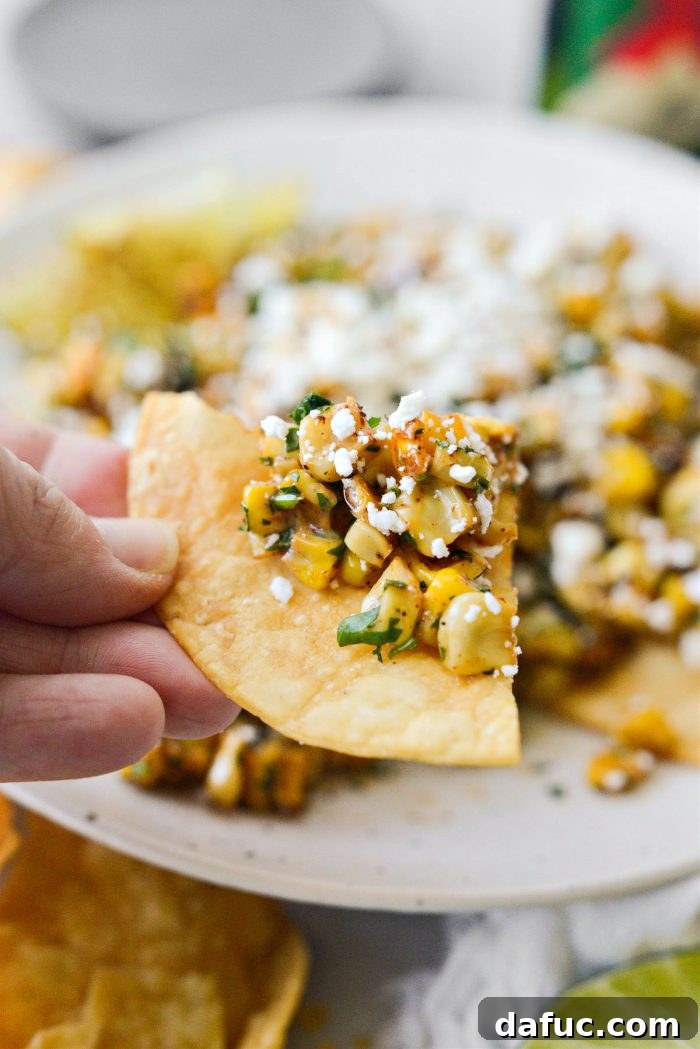 Zesty Mexican Street Corn Dip 12 Mexican Street Corn Salsa on a tortilla chip, ready to eat