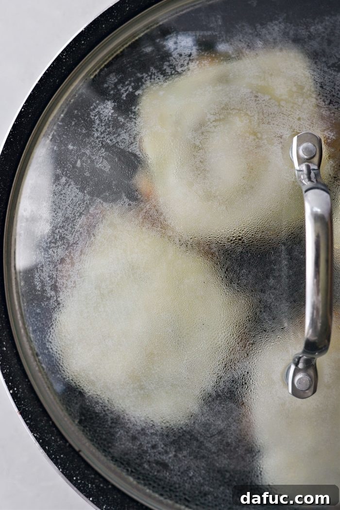 Flipping the chicken smash burgers
