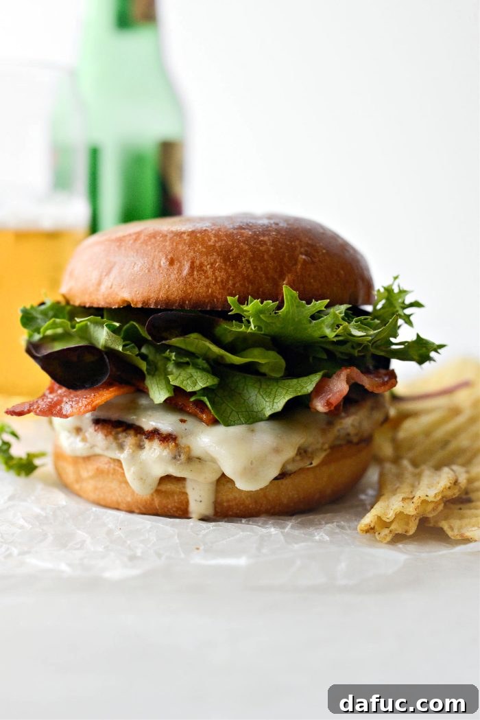 Melted cheese on chicken smash burgers