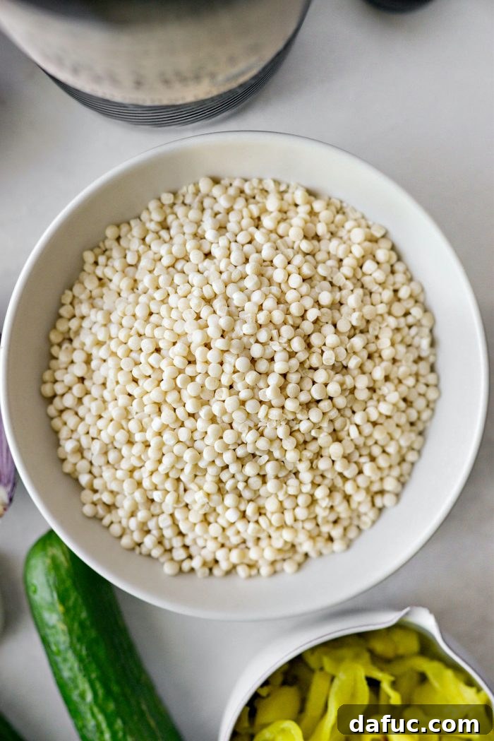 Vibrant Mediterranean Couscous Salad 5 Cooked Israeli couscous ready for mixing.