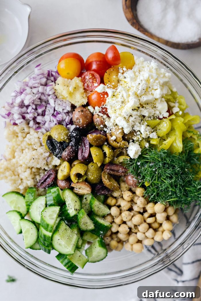 Vibrant Mediterranean Couscous Salad 8 Seasoning the salad with freshly ground black pepper.