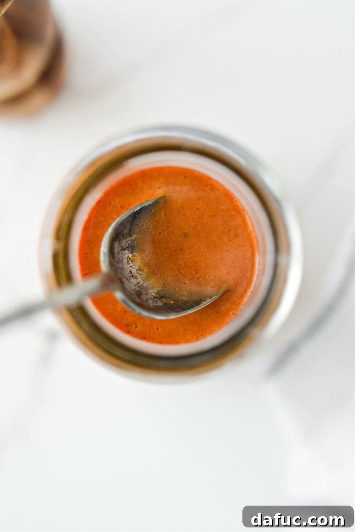 Tangy Homemade Catalina Vinaigrette 11 Homemade Catalina Dressing in a glass jar, showcasing its texture and rich color.