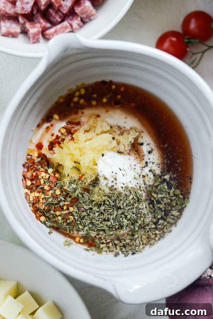 Dressing ingredients in a bowl before mixing