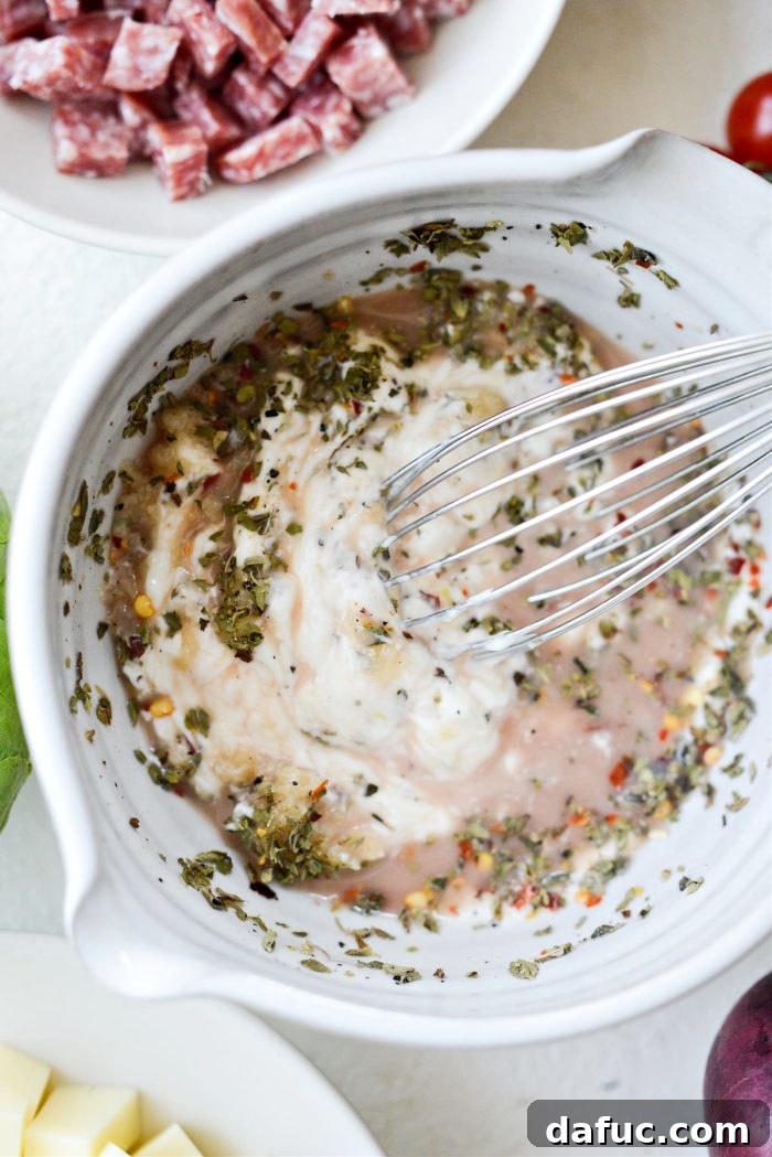 whisking dressing ingredients