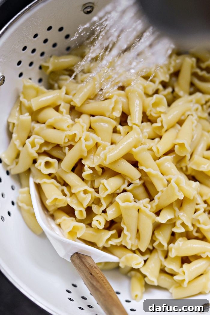 rinsing cooked pasta with cold water