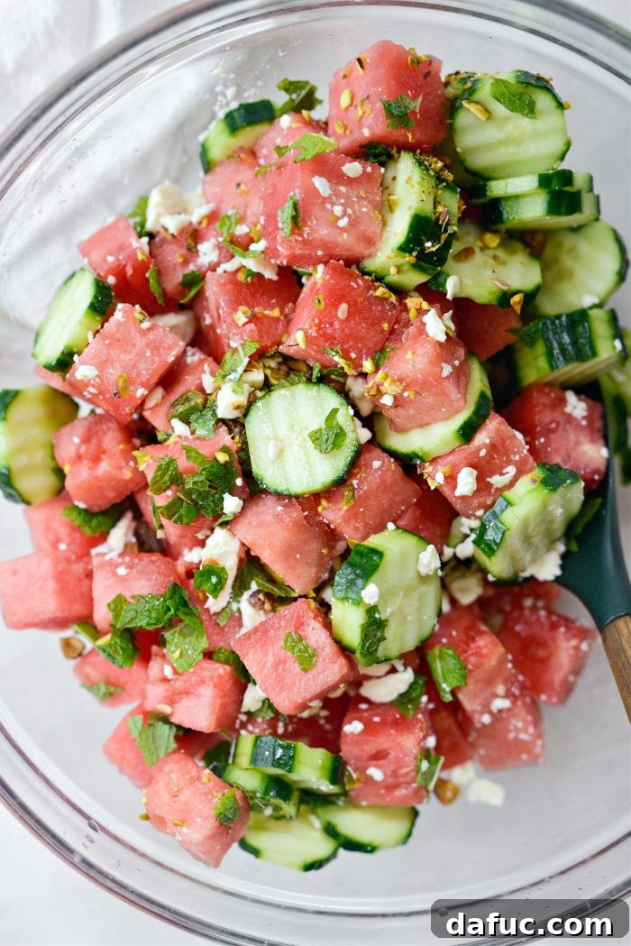 Refreshing Watermelon Feta Cucumber Salad 8 Squeezing fresh lime juice over the watermelon feta salad