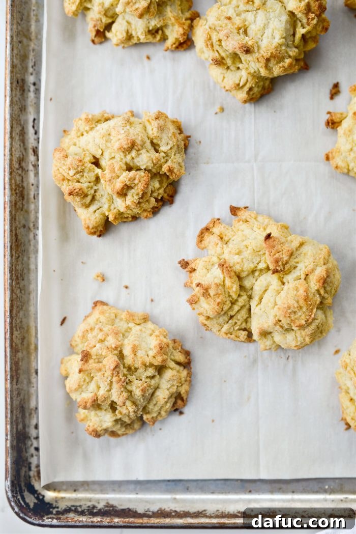 Effortlessly Fluffy Drop Biscuits 11 Baked easy homemade drop biscuits cooling on a wire rack.