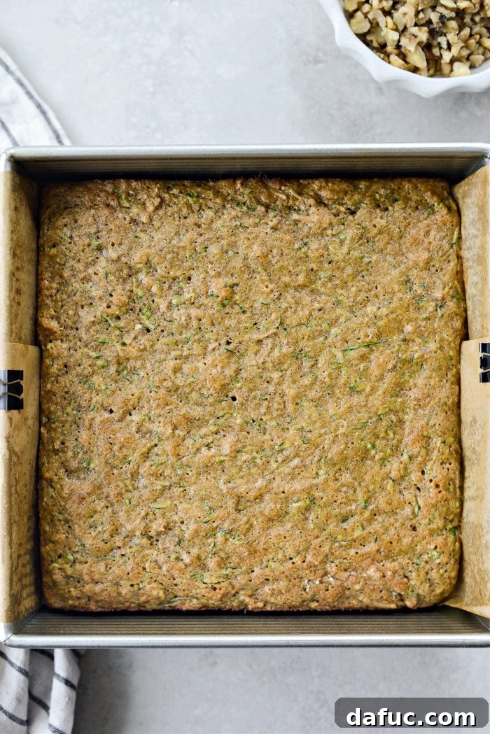 Lush Zucchini Cake with Cream Cheese Frosting 11 Freshly baked Zucchini Cake cooling on a wire rack