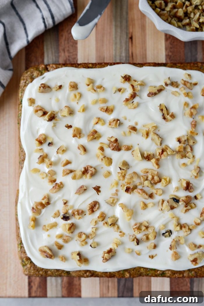 Lush Zucchini Cake with Cream Cheese Frosting 20 Topping Zucchini Cake with Cream Cheese Frosting with chopped toasted walnuts