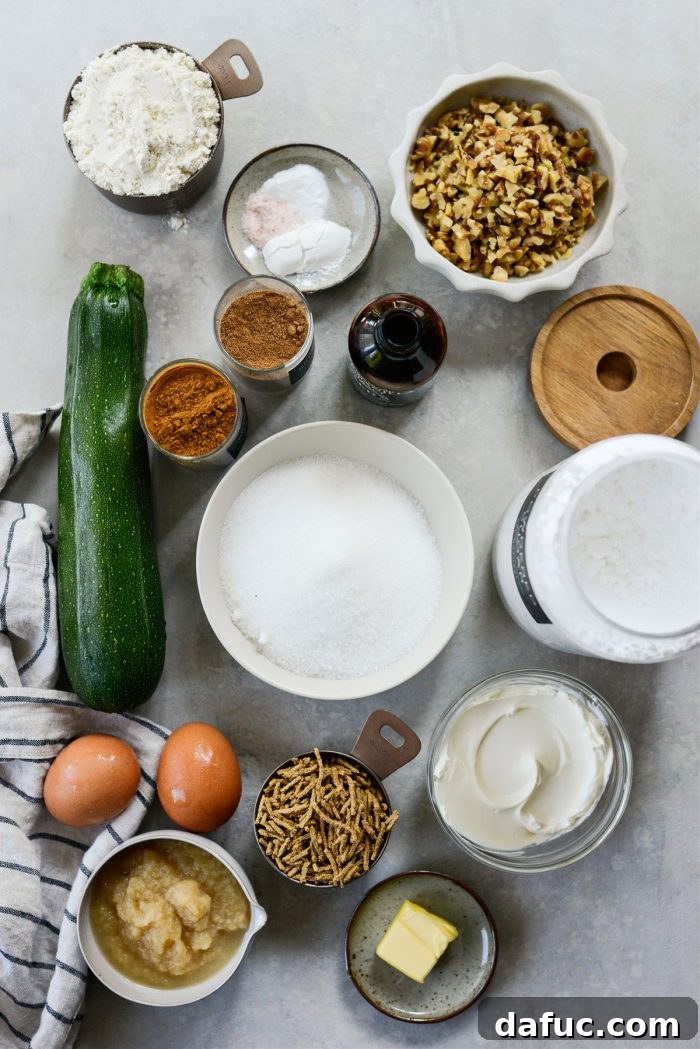 Lush Zucchini Cake with Cream Cheese Frosting 4 Ingredients laid out for Zucchini Cake with Cream Cheese Frosting, including flour, sugar, zucchini, and spices