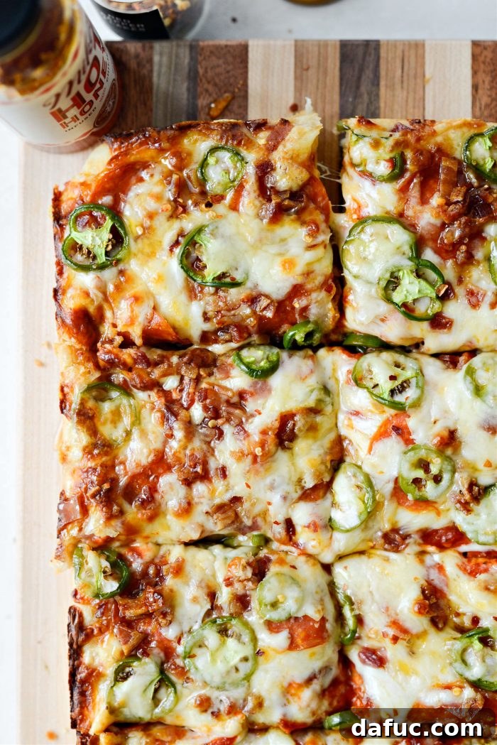 Sweet Heat Bacon Jalapeño Pizza 17 Bacon Jalapeno Focaccia Pizza served on a cutting board