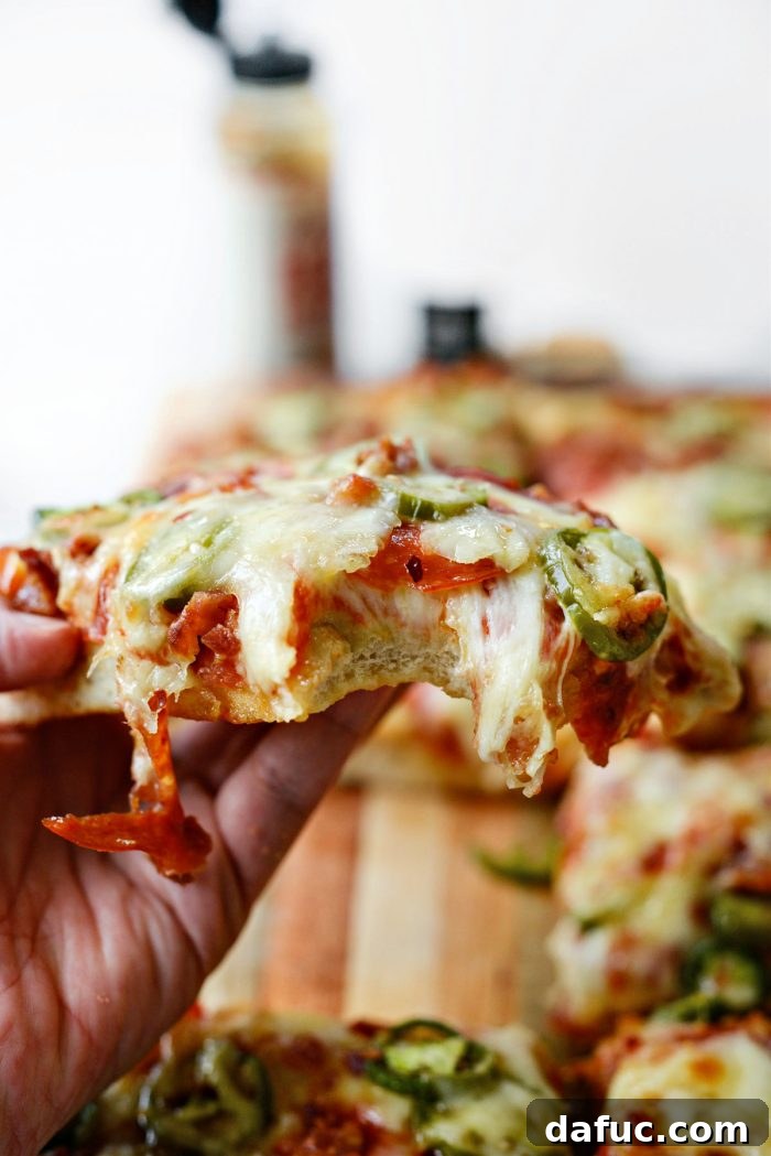 Another enticing close-up of a slice of Bacon Jalapeño Focaccia Pizza