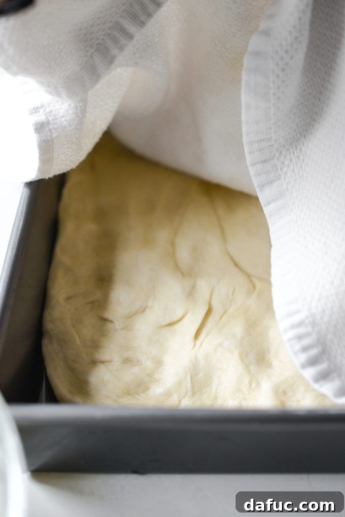 Sweet Heat Bacon Jalapeño Pizza 7 Focaccia dough rising for the second time under a kitchen towel